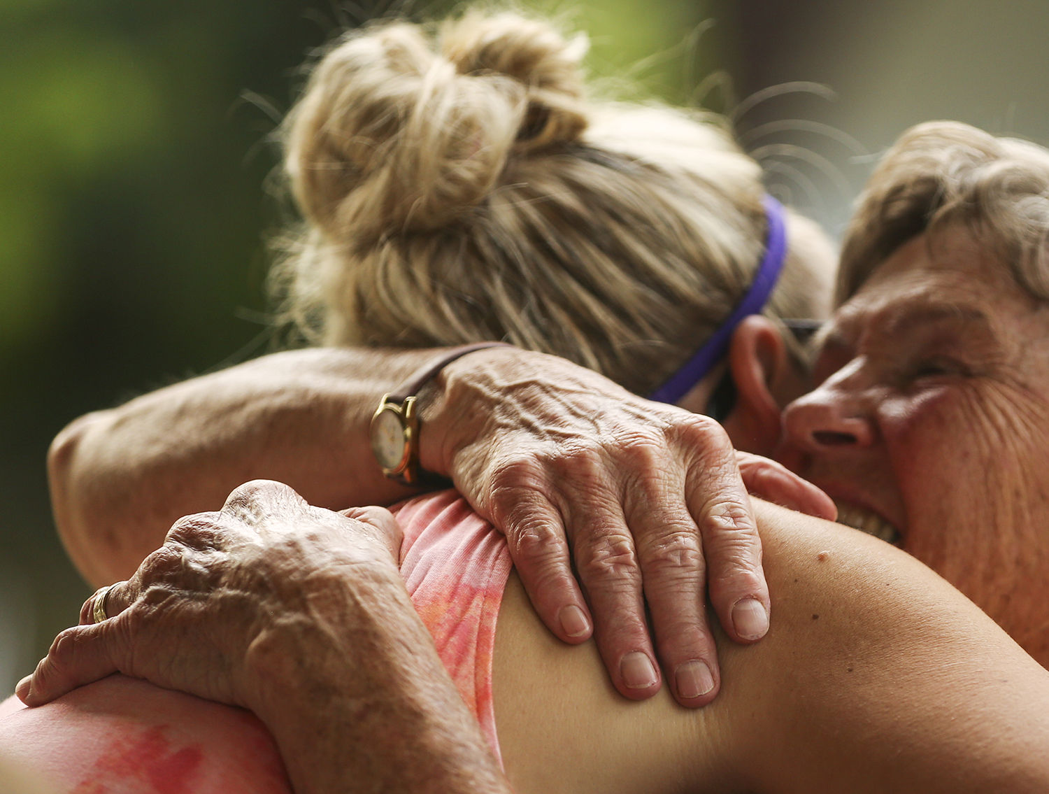 Linda Metzer hugs Cara Culliton during the picnic event that closed out the MOBs year